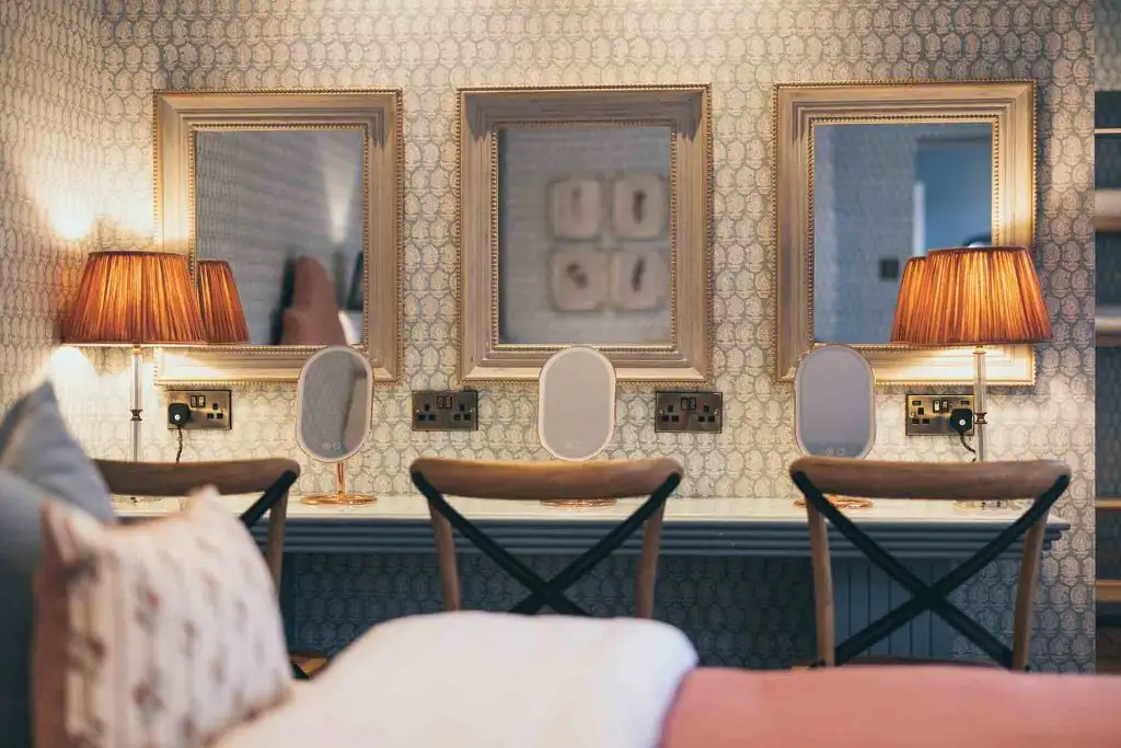 Dressing table with mirrors and lighting in a bridal suite