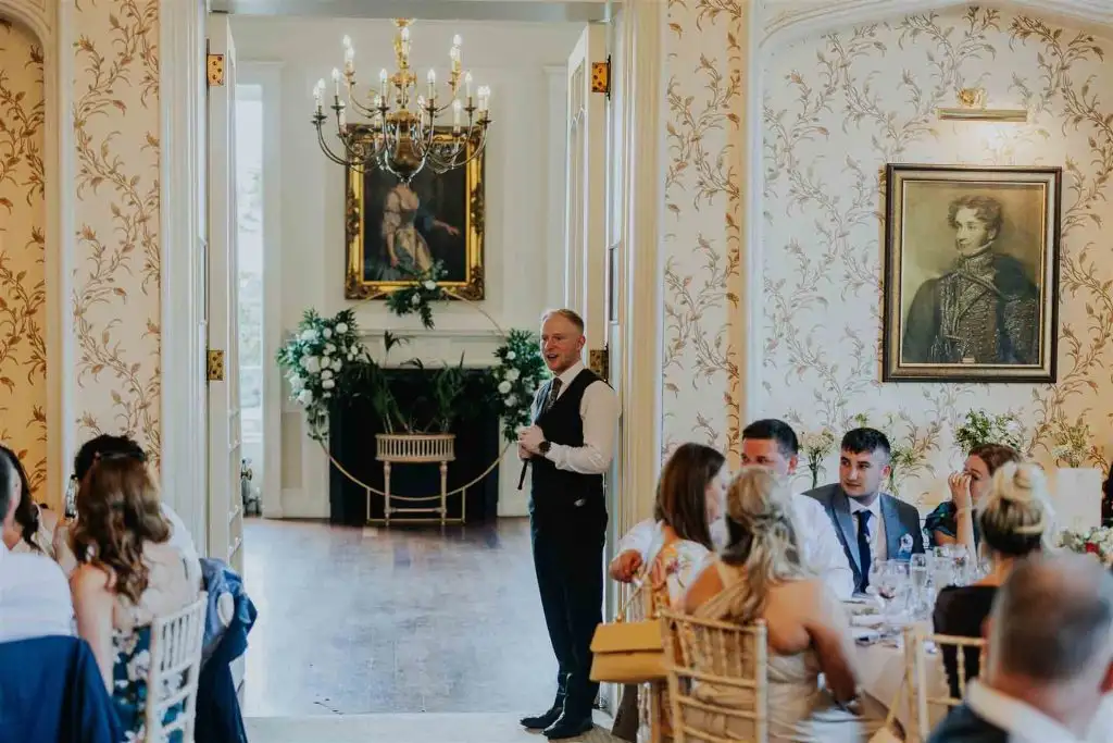 Best man giving a wedding speech during the reception in the Rowton Castle dining room