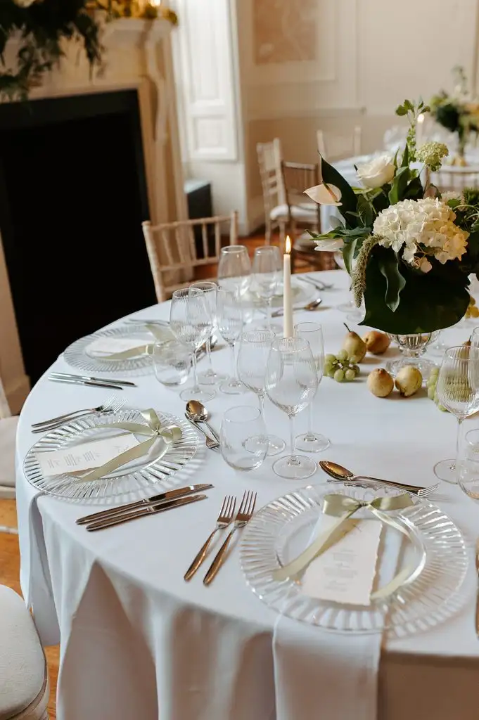 Wedding reception tables arranged in the Rowton Castle dining room beside large windows