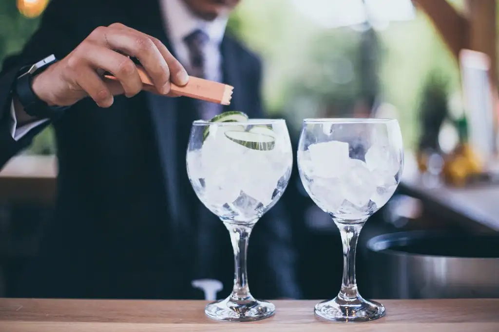Bartender preparing gin and tonic cocktails during a Rowton Castle wedding reception