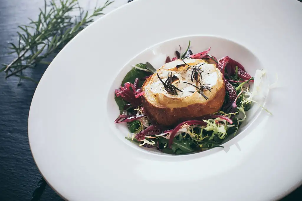 Goat’s cheese starter served with salad and herbs at Rowton Castle wedding breakfast